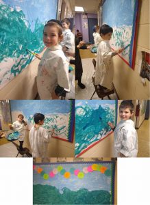 Pre 1A painting their Adar bulletin board!